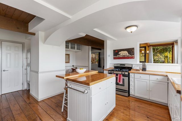 a living room with furniture and floor to ceiling windows
