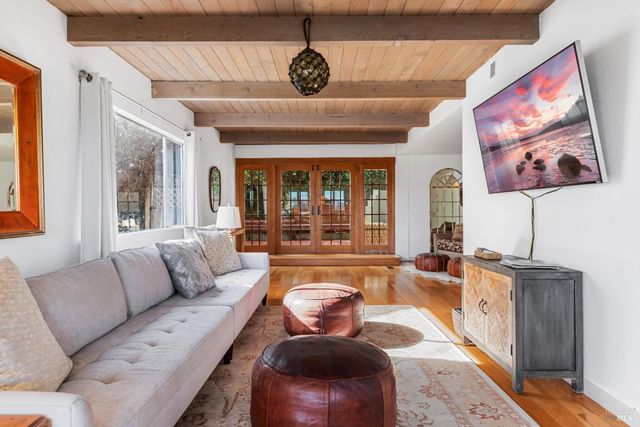 a view of deck with chairs and wooden floor