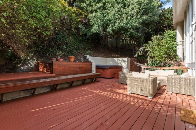 a dining room with wooden floor and furniture