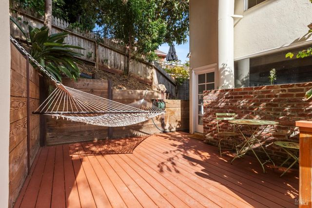 a bedroom with a large bed and a view of kitchen