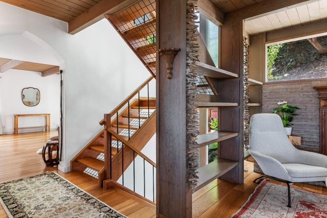 a living room with furniture and a lamp