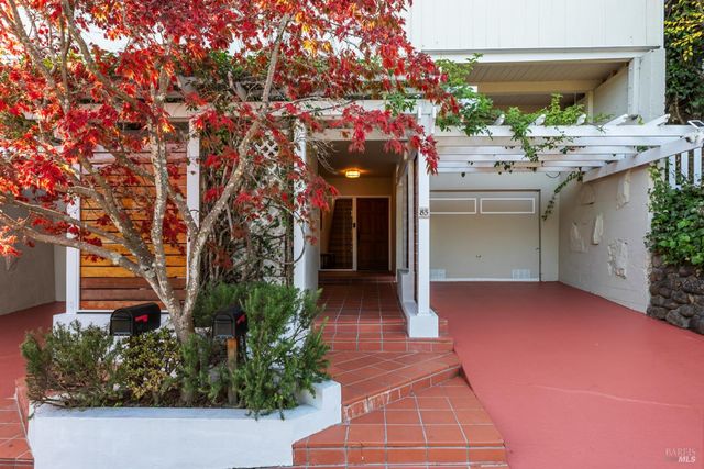 a view of a house with a backyard and a garden