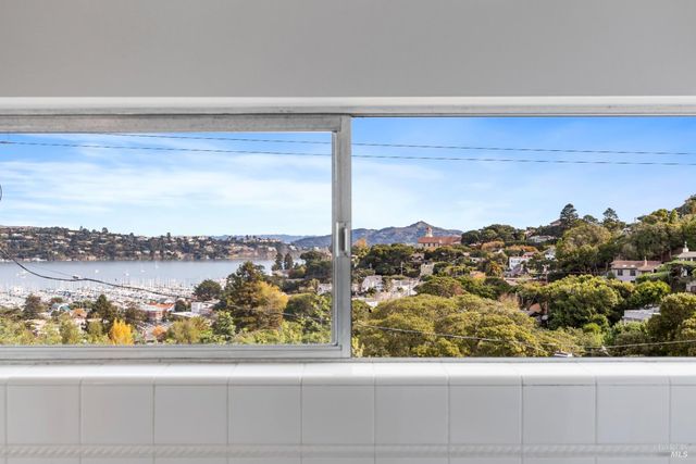 a bathroom with a sink mirror and toilet