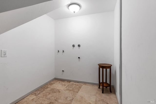 a bathroom with a toilet and a mirror