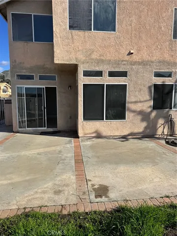 a view of swimming pool with a lounge chairs