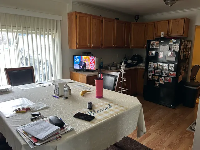 a work place with furniture a flat screen tv and a window