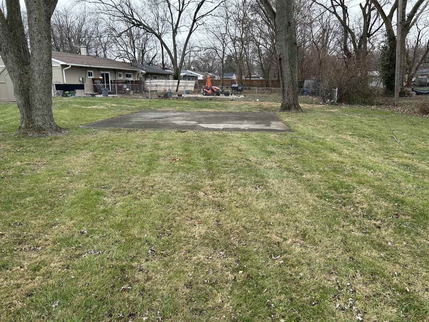 16302 Trumbull Avenue Markham, IL 60428 - Photo 10 of 12 a view of road with large trees
