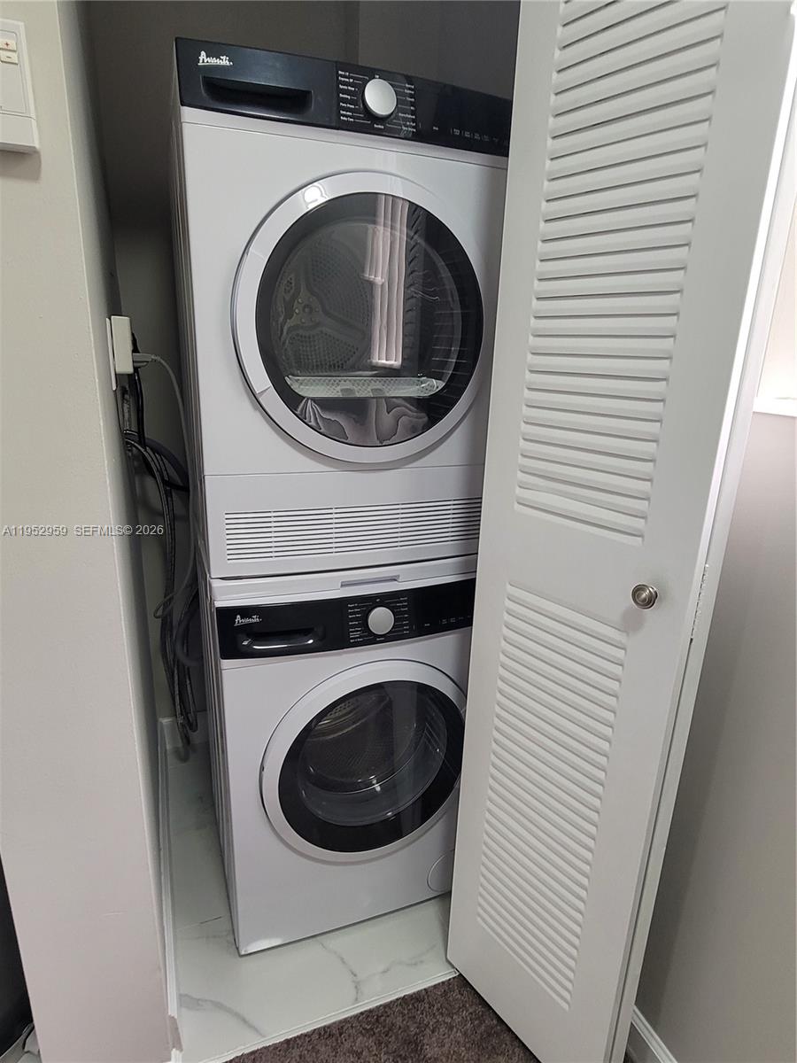 853 Southwest 2nd Street, Unit 207 Miami, FL 33130 - Photo 17 of 19 a utility room with dryer and washer