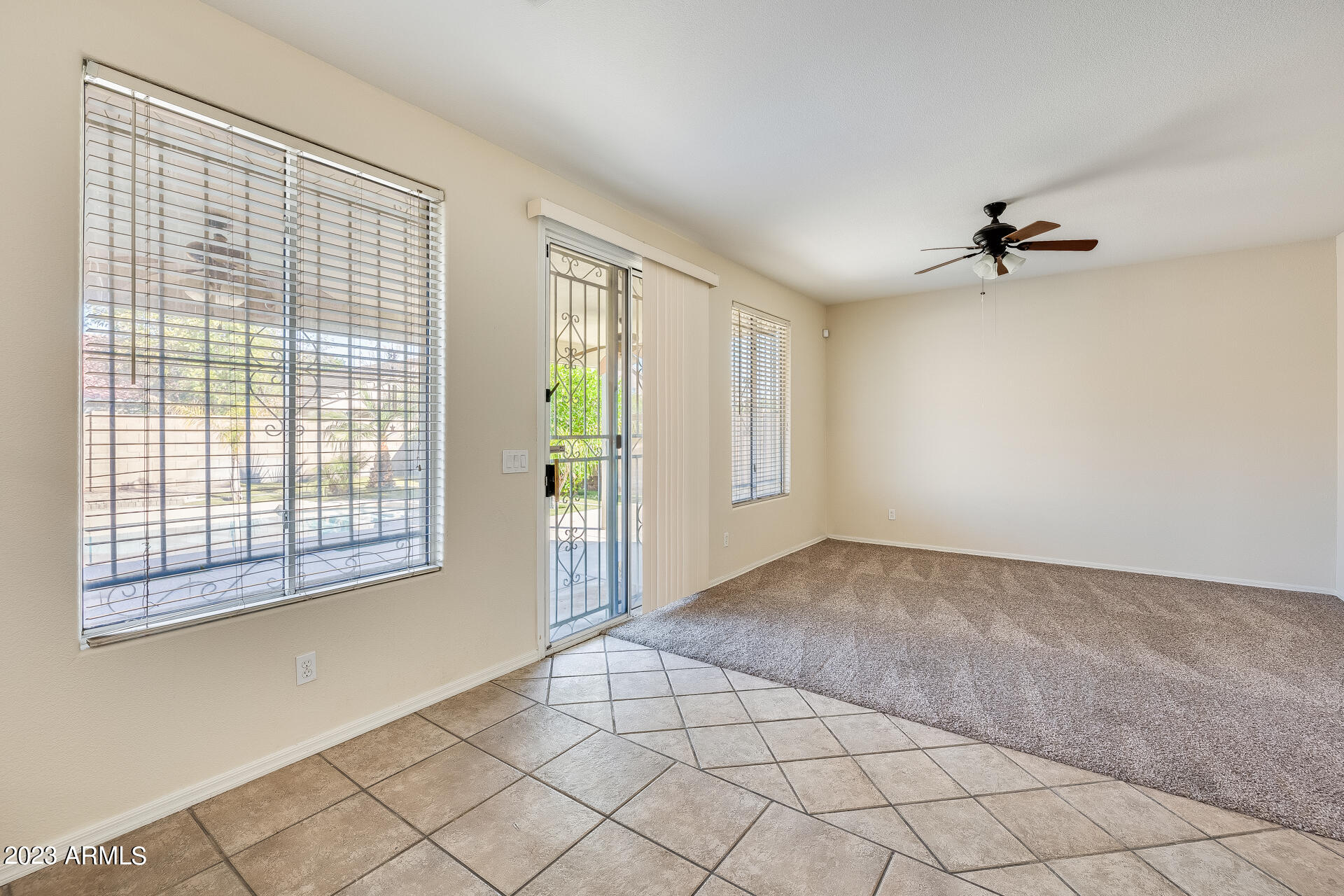 3244 West Maldonado Road Phoenix, AZ 85041 - Photo 17 of 43 a view of an empty room with a window