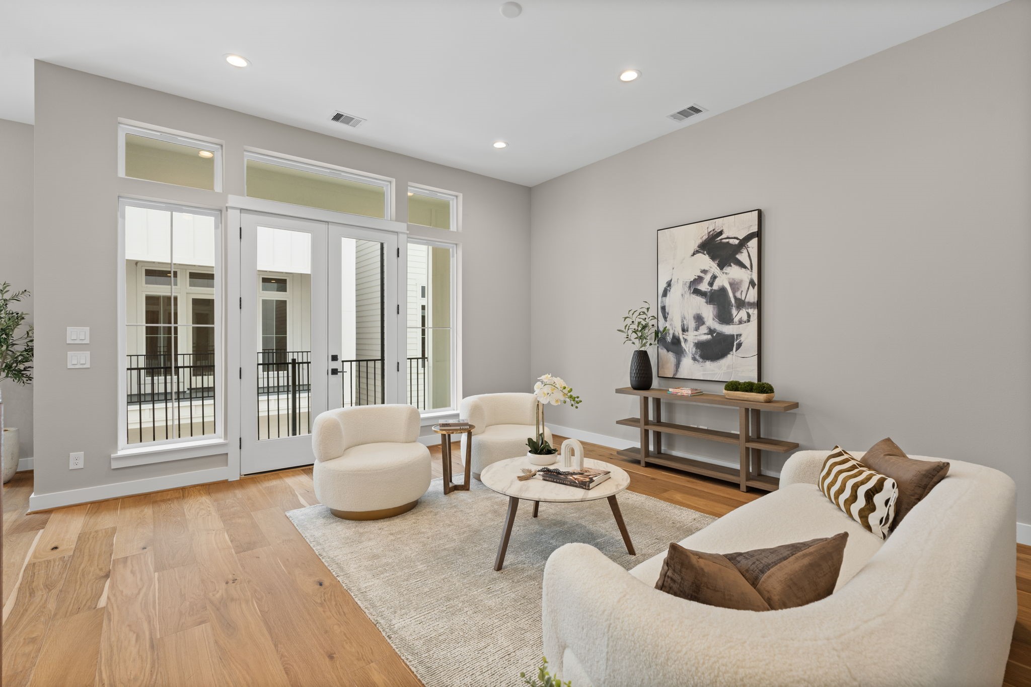 1177 West 19th Street Houston, TX 77008 - Photo 24 of 40 a living room with furniture and a floor to ceiling window