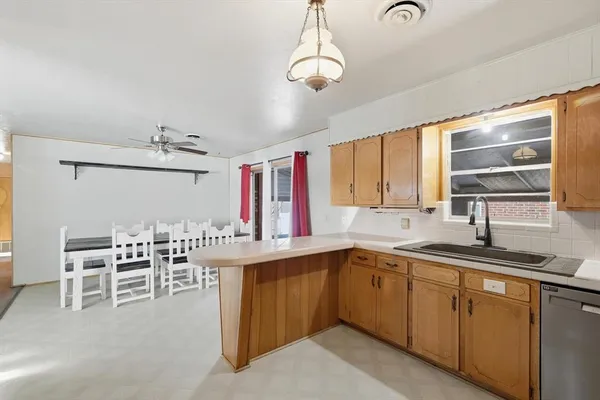 a kitchen with a sink and cabinets
