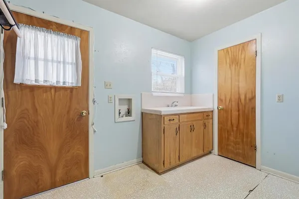 a view of a bathroom with mirror door