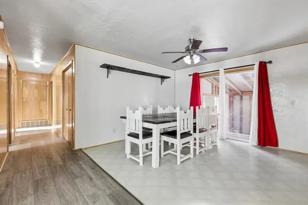 a dining room with furniture and window