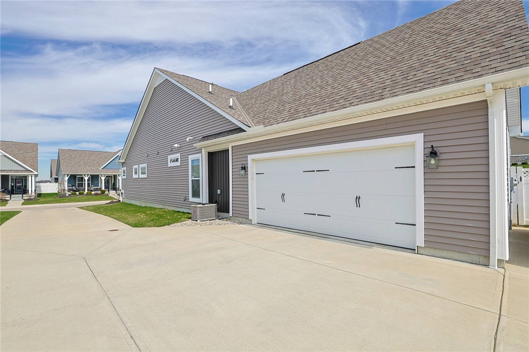 5013 Arena Court Hamilton, OH 45011 - Photo 36 of 41 This home features a practical garage and a welcoming entrance with modern details.