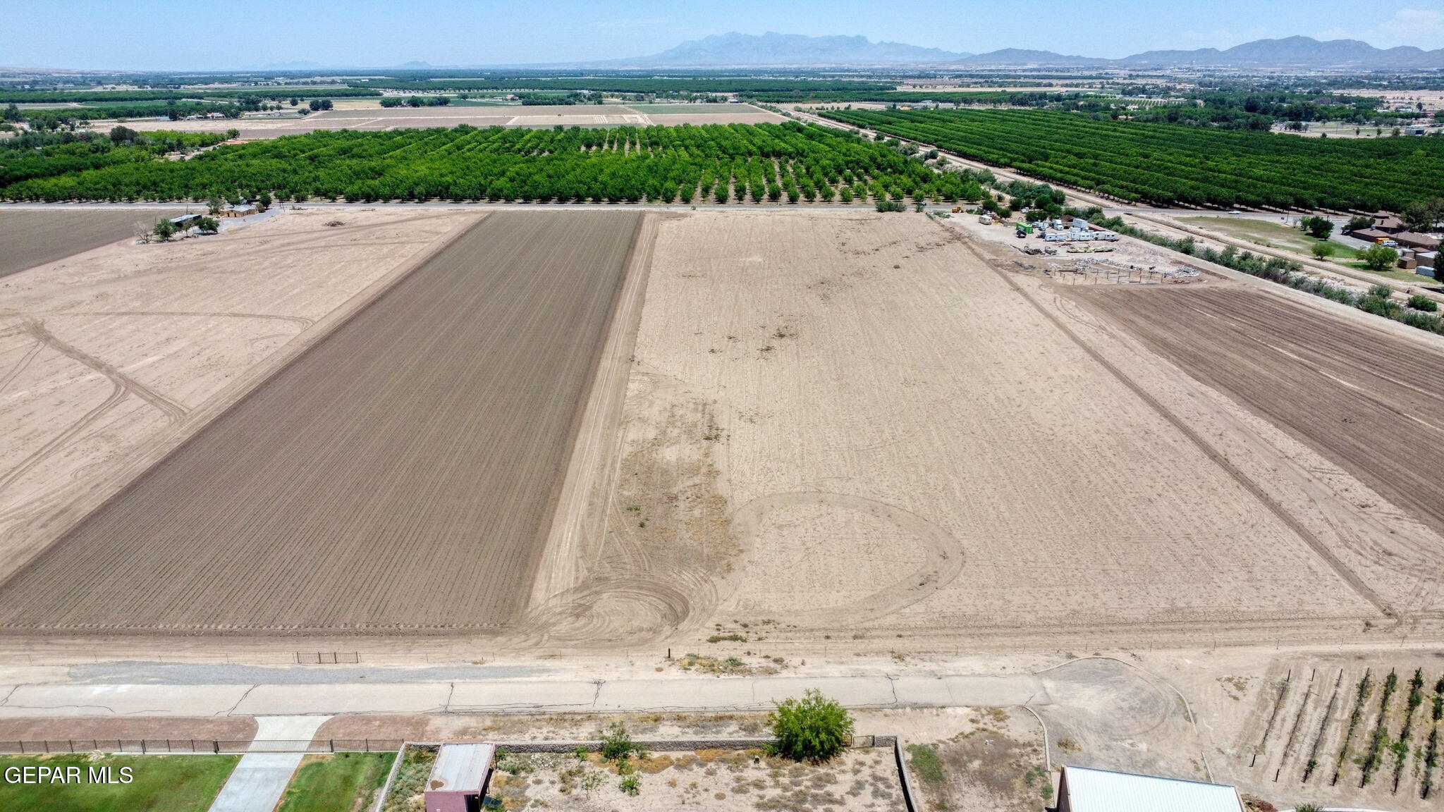 7036 McNutt Road Anthony, NM 88021 - Photo 12 of 23 an aerial view of a house with a yard and lake view