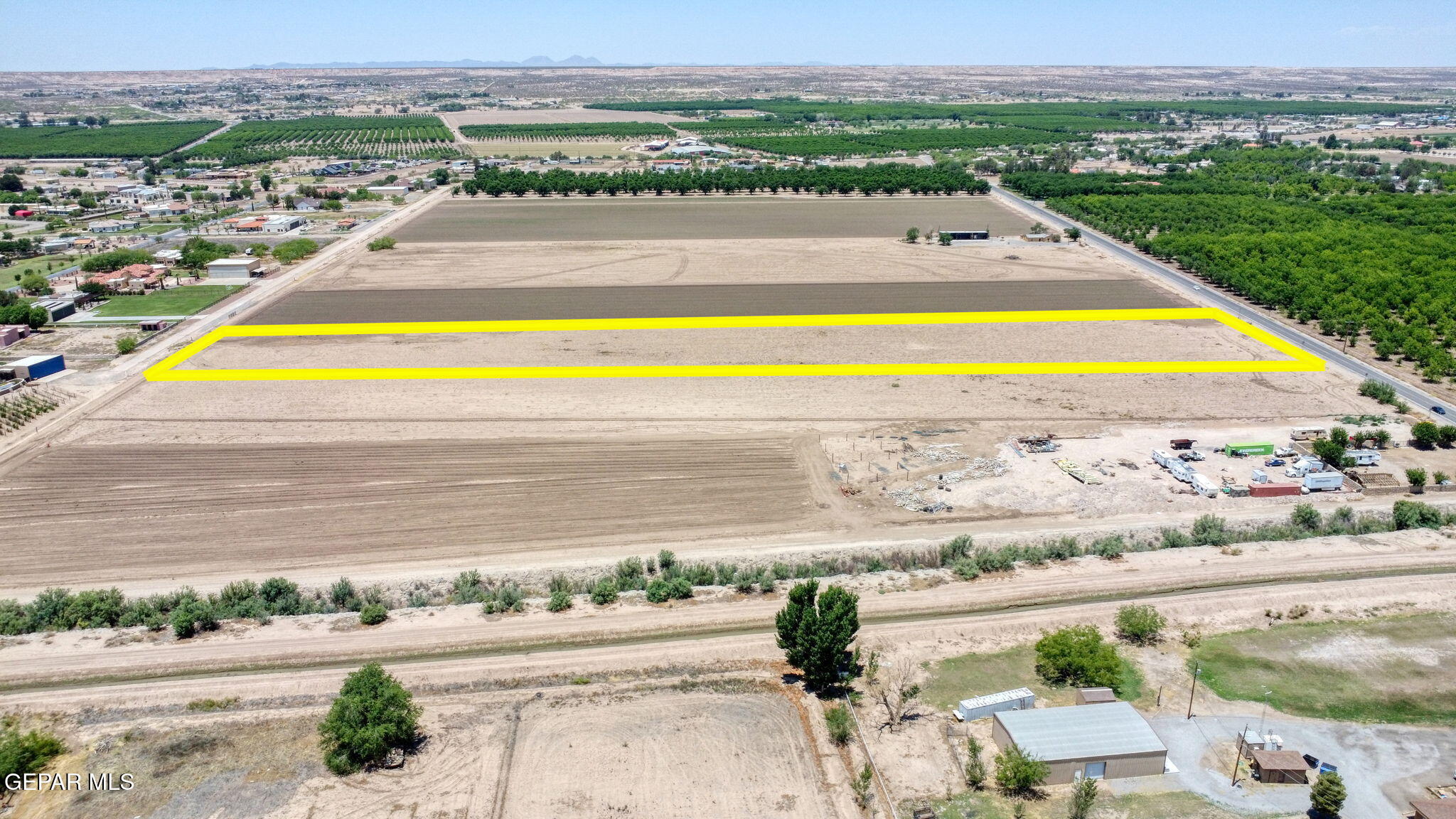 7036 McNutt Road Anthony, NM 88021 - Photo 16 of 23 a view of swimming pool with lawn chairs and large trees