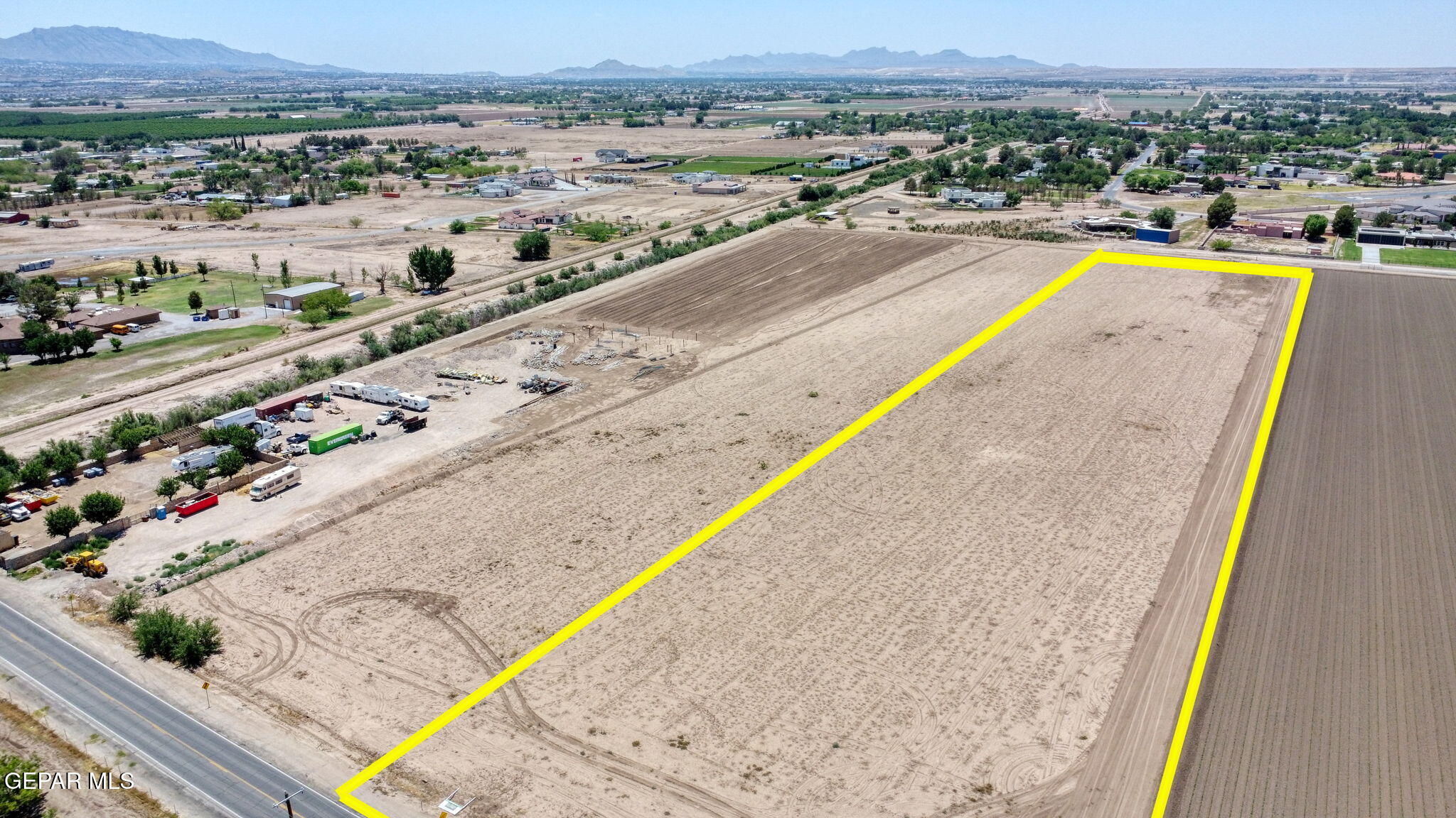 7036 McNutt Road Anthony, NM 88021 - Photo 6 of 23 a view of a swimming pool with a lounge chair