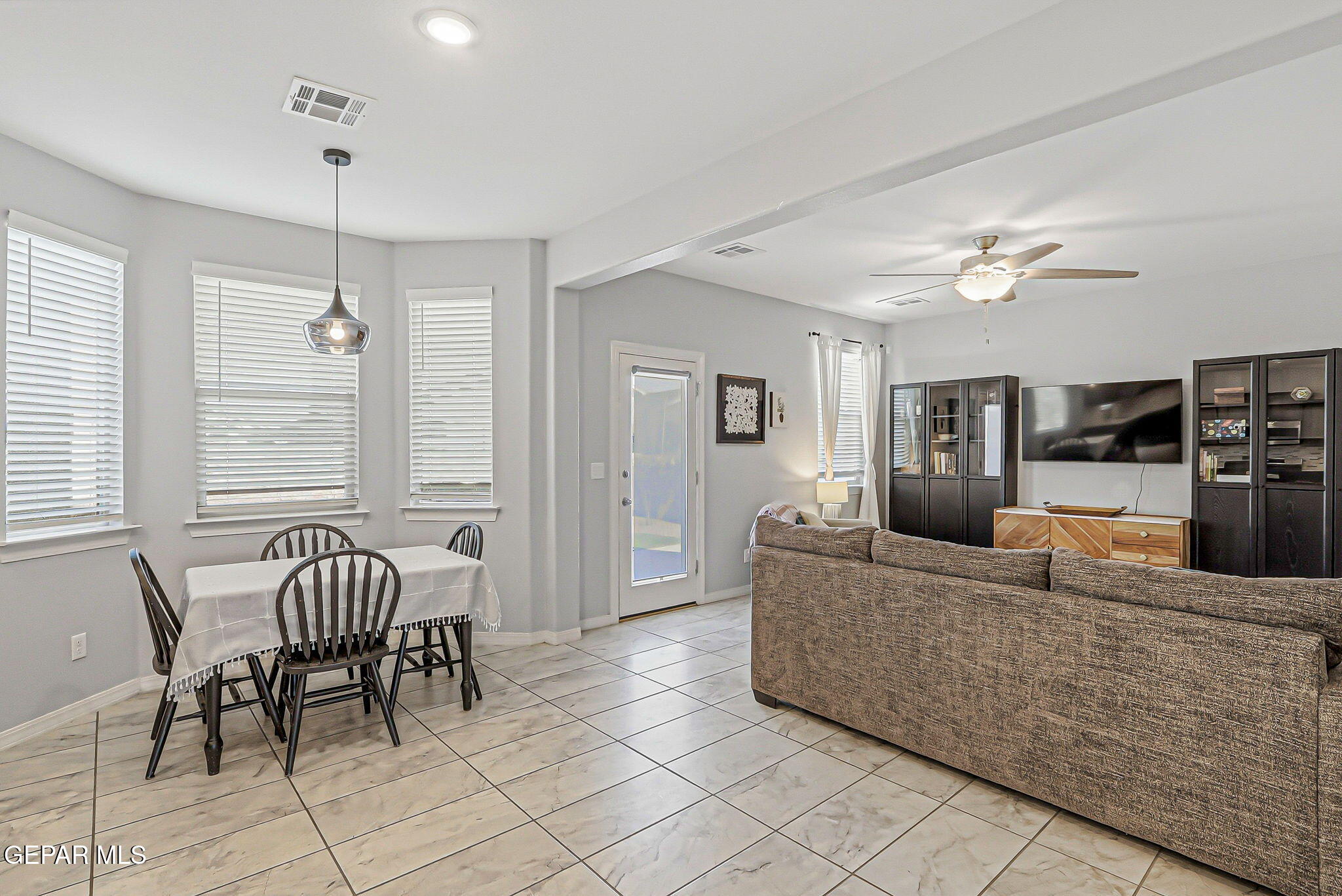 525 Issa Circle El Paso, TX 79932 - Photo 13 of 47 a living room with furniture and a chandelier