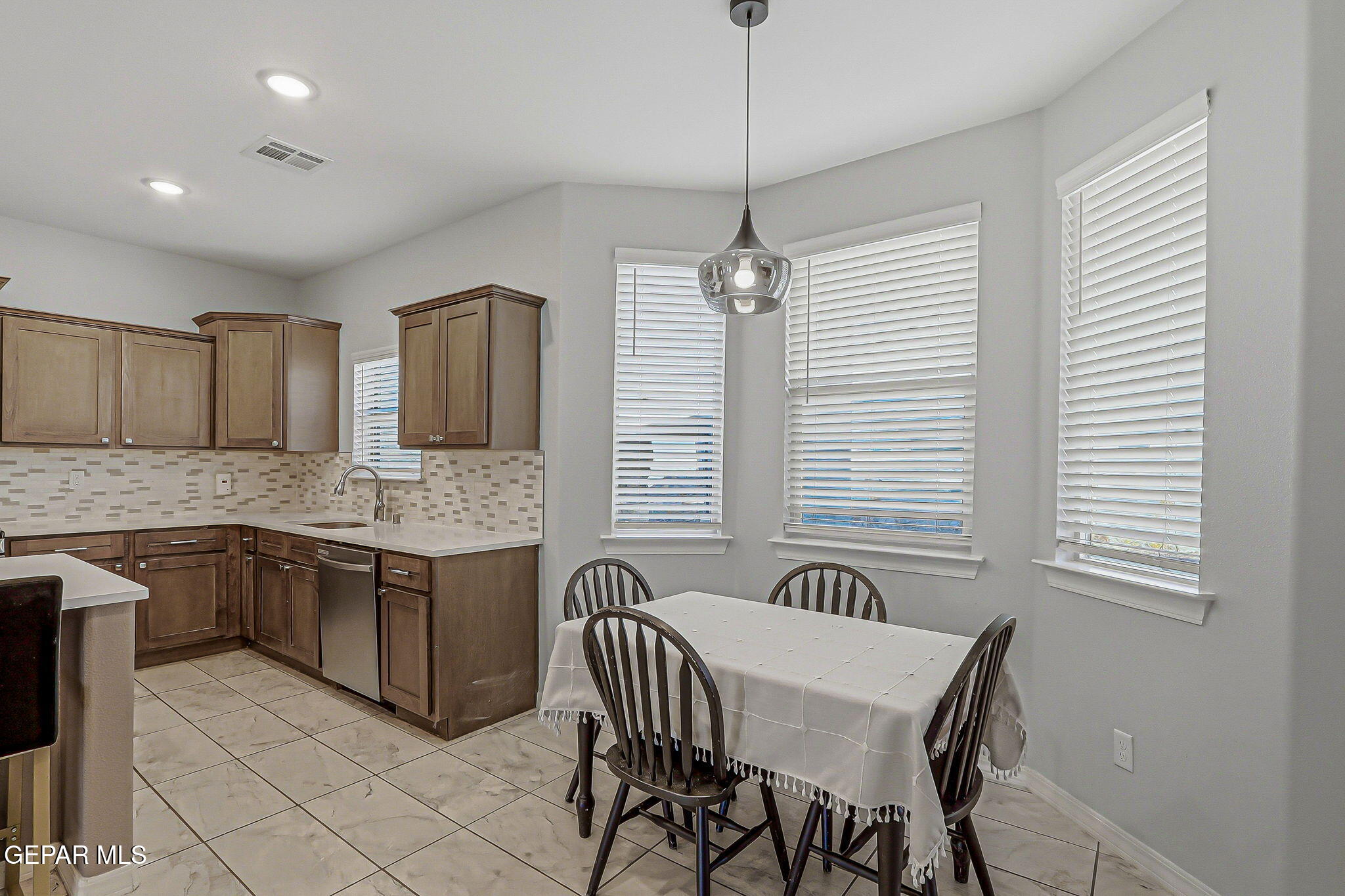 525 Issa Circle El Paso, TX 79932 - Photo 16 of 47 a view of a kitchen with granite countertop furniture and wooden floor