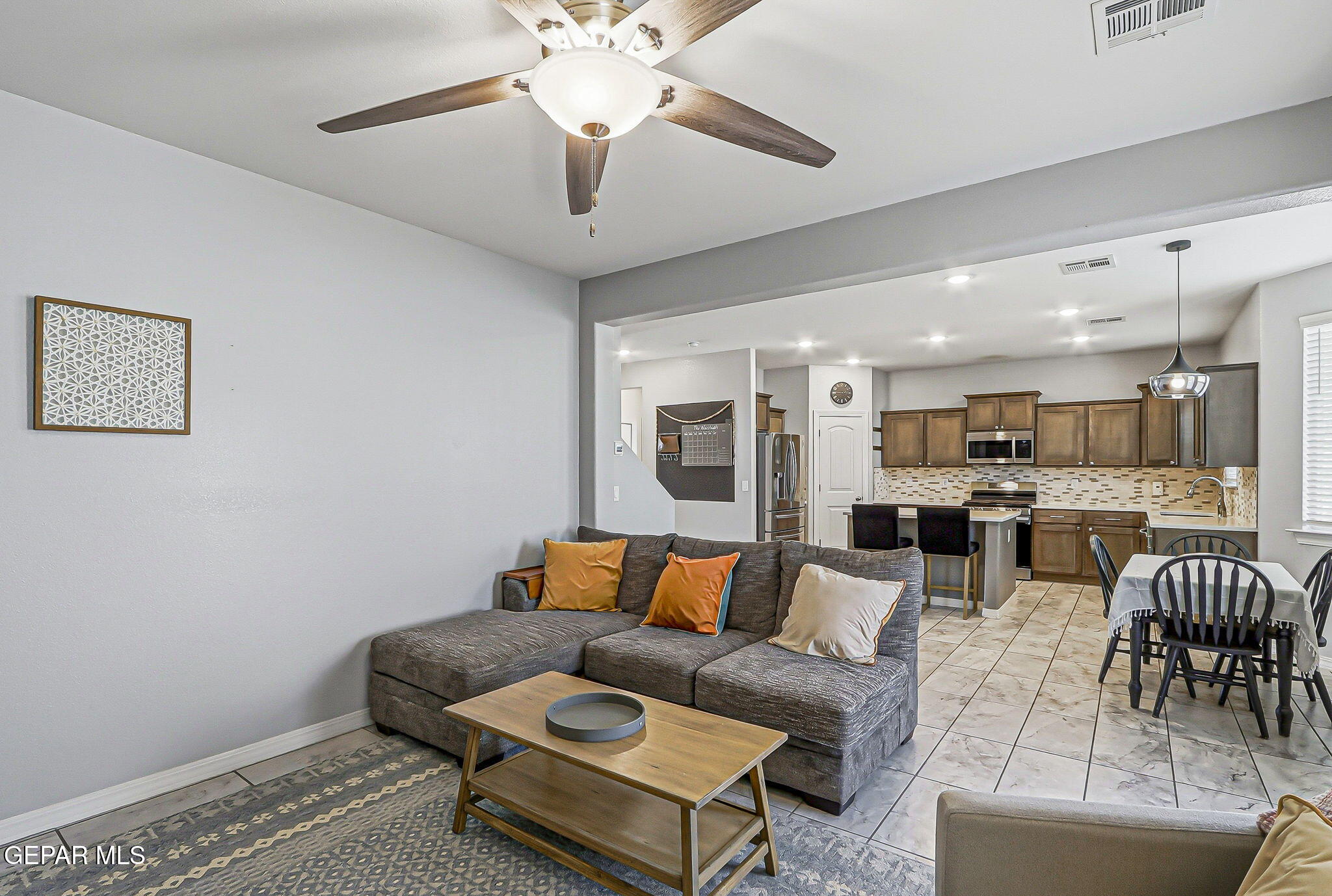 525 Issa Circle El Paso, TX 79932 - Photo 30 of 47 a living room with furniture kitchen view and a chandelier