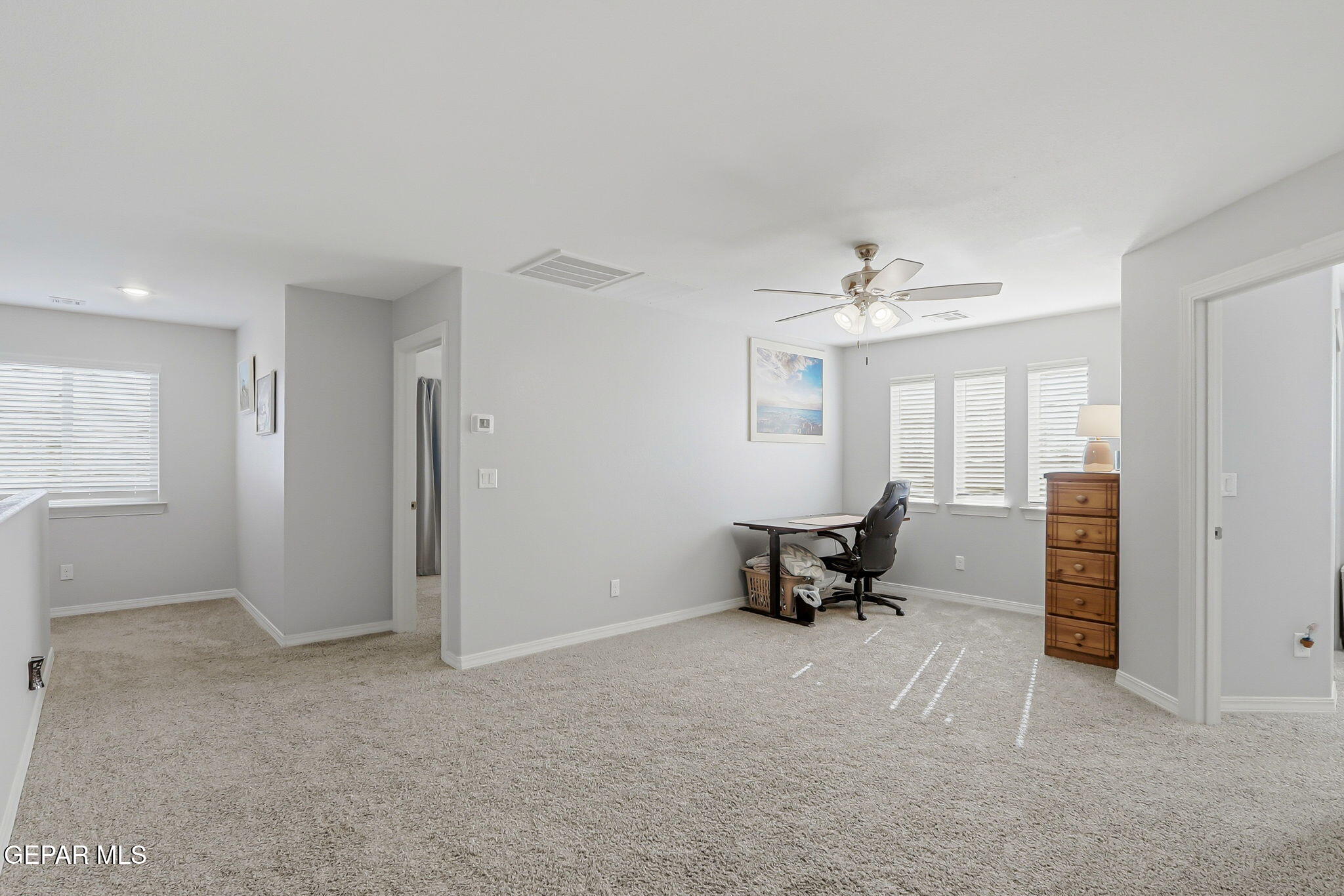 525 Issa Circle El Paso, TX 79932 - Photo 35 of 47 a living room with furniture and a chandelier