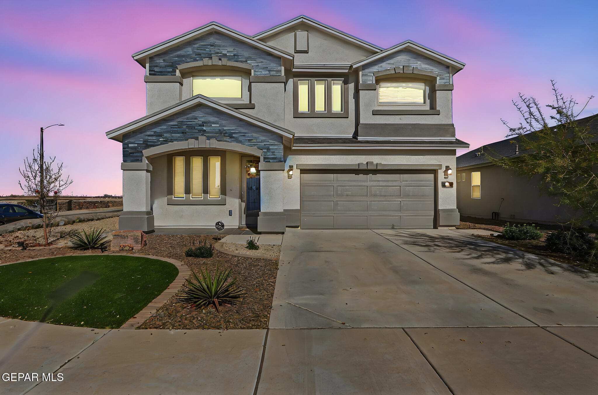 525 Issa Circle El Paso, TX 79932 - Photo 4 of 47 a front view of a house with a yard