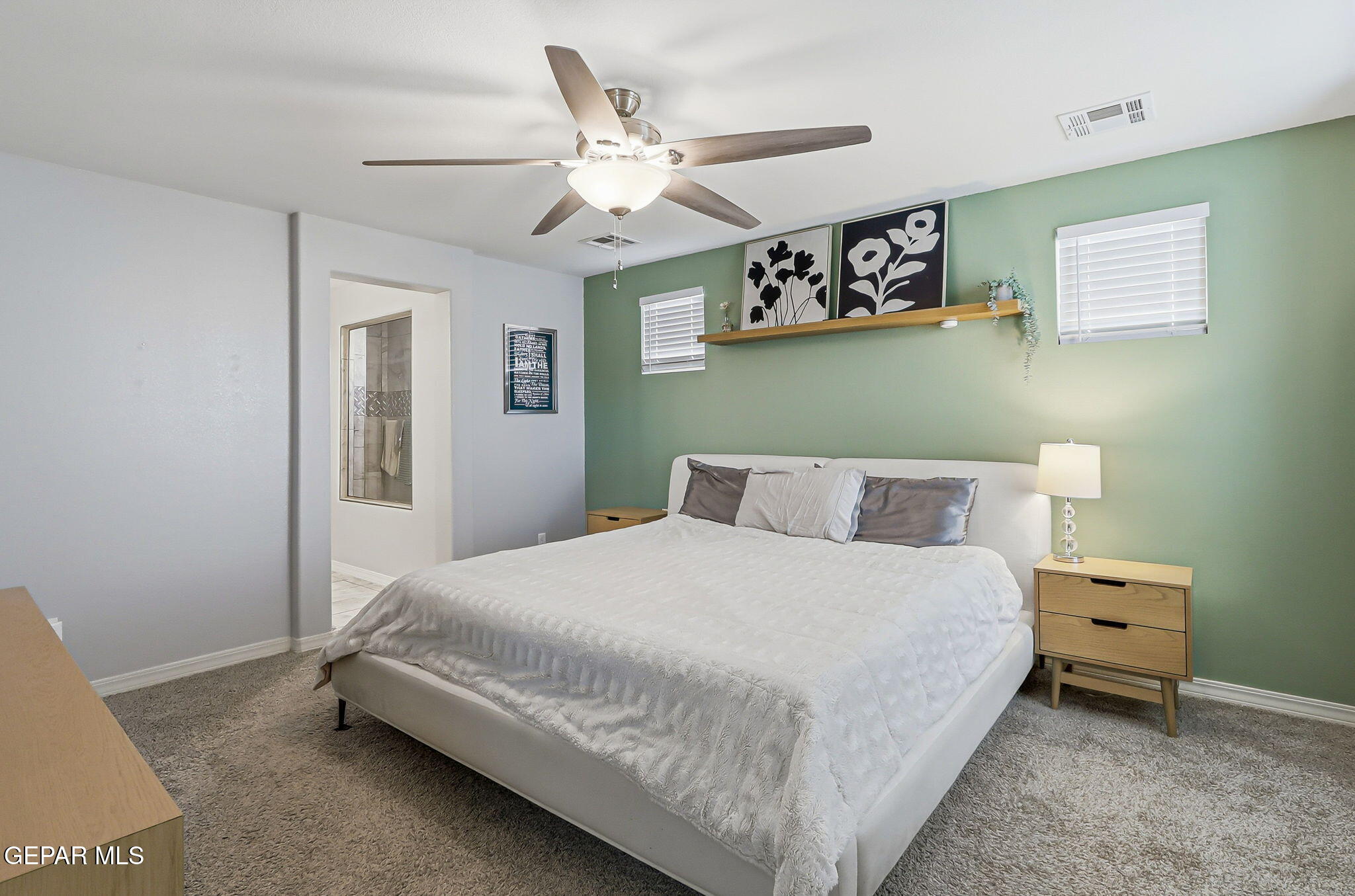 525 Issa Circle El Paso, TX 79932 - Photo 42 of 47 a bedroom with a bed and a chandelier