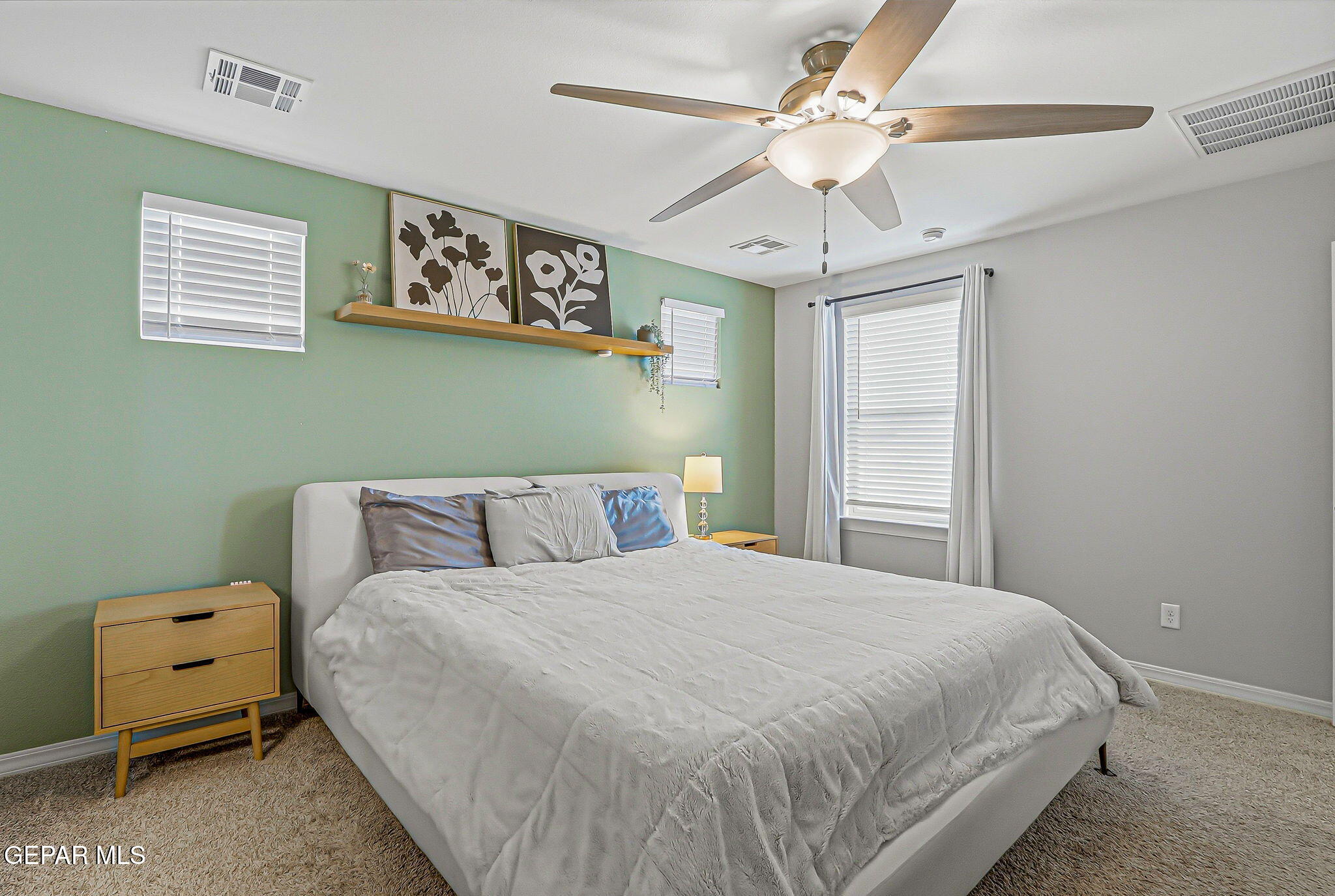 525 Issa Circle El Paso, TX 79932 - Photo 43 of 47 a bedroom with a bed and a chandelier