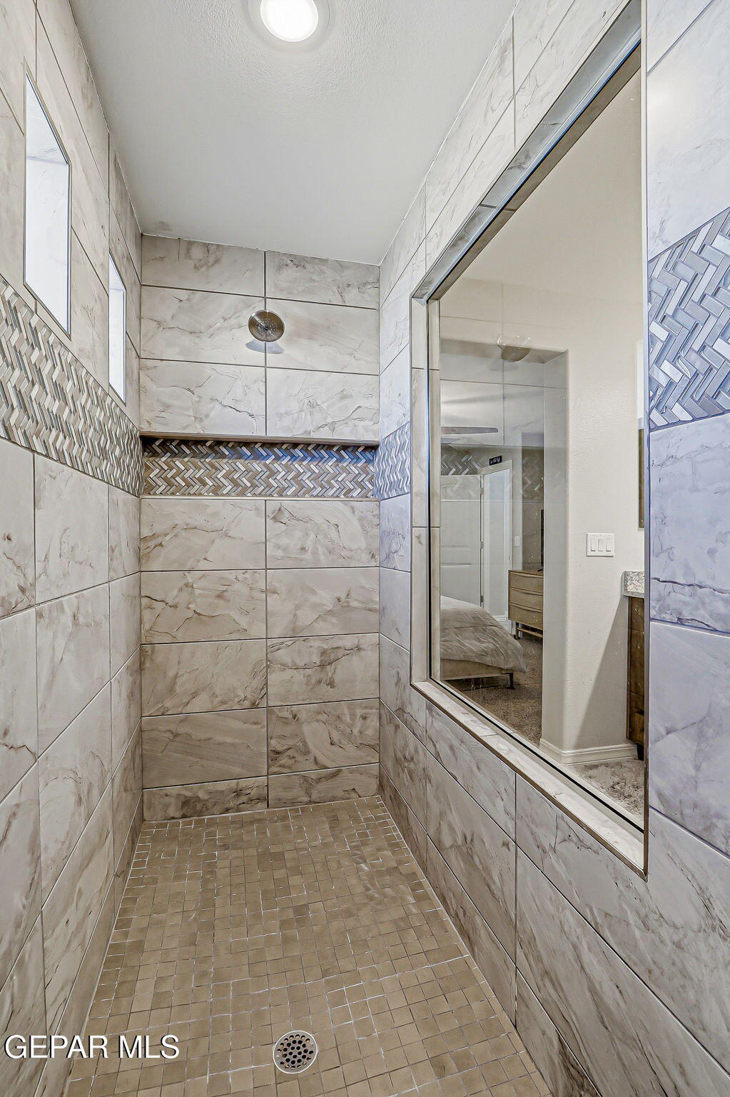 525 Issa Circle El Paso, TX 79932 - Photo 47 of 47 a bathroom with a shower and mirror