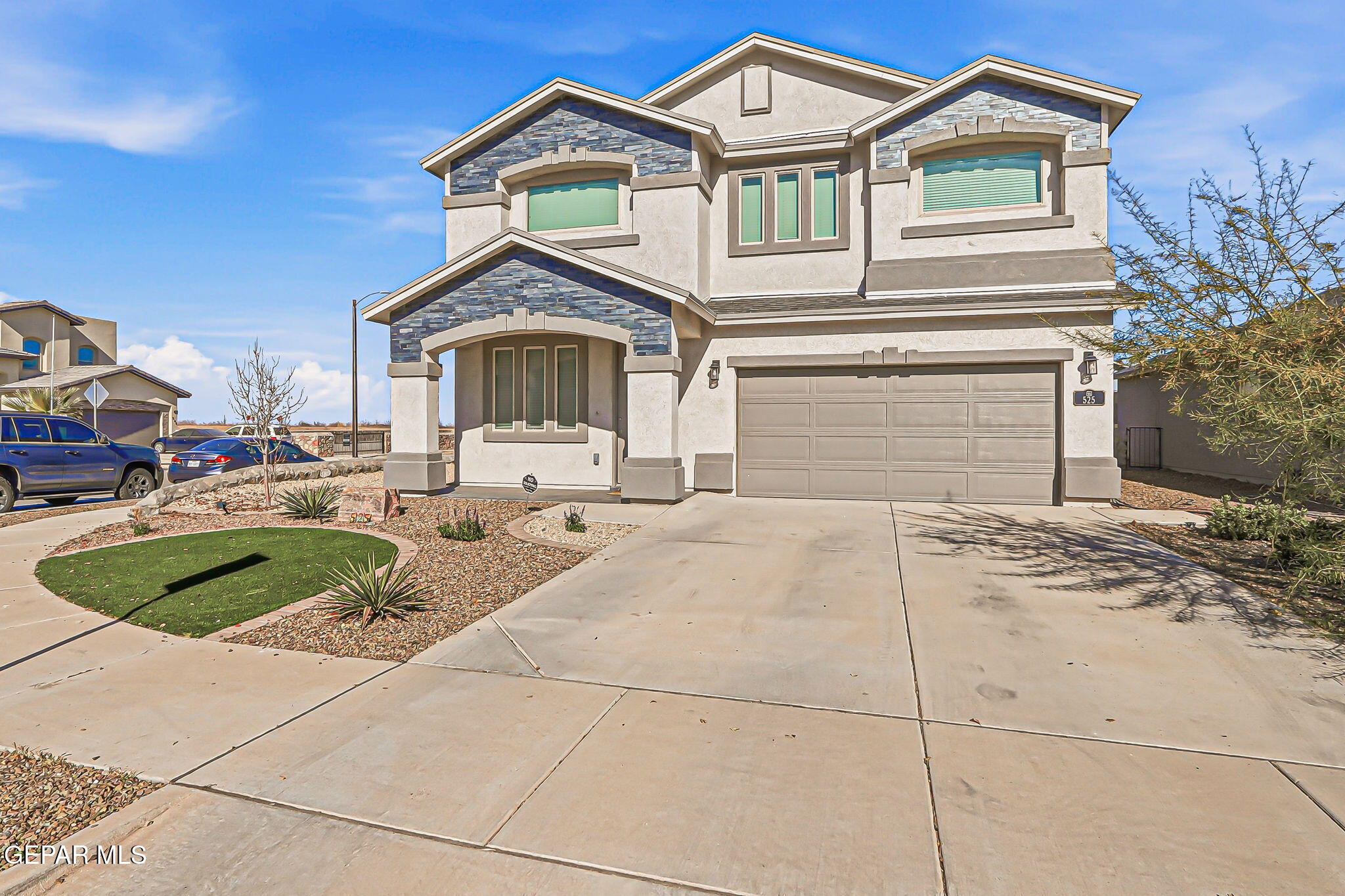 525 Issa Circle El Paso, TX 79932 - Photo 5 of 47 a front view of a house with a yard