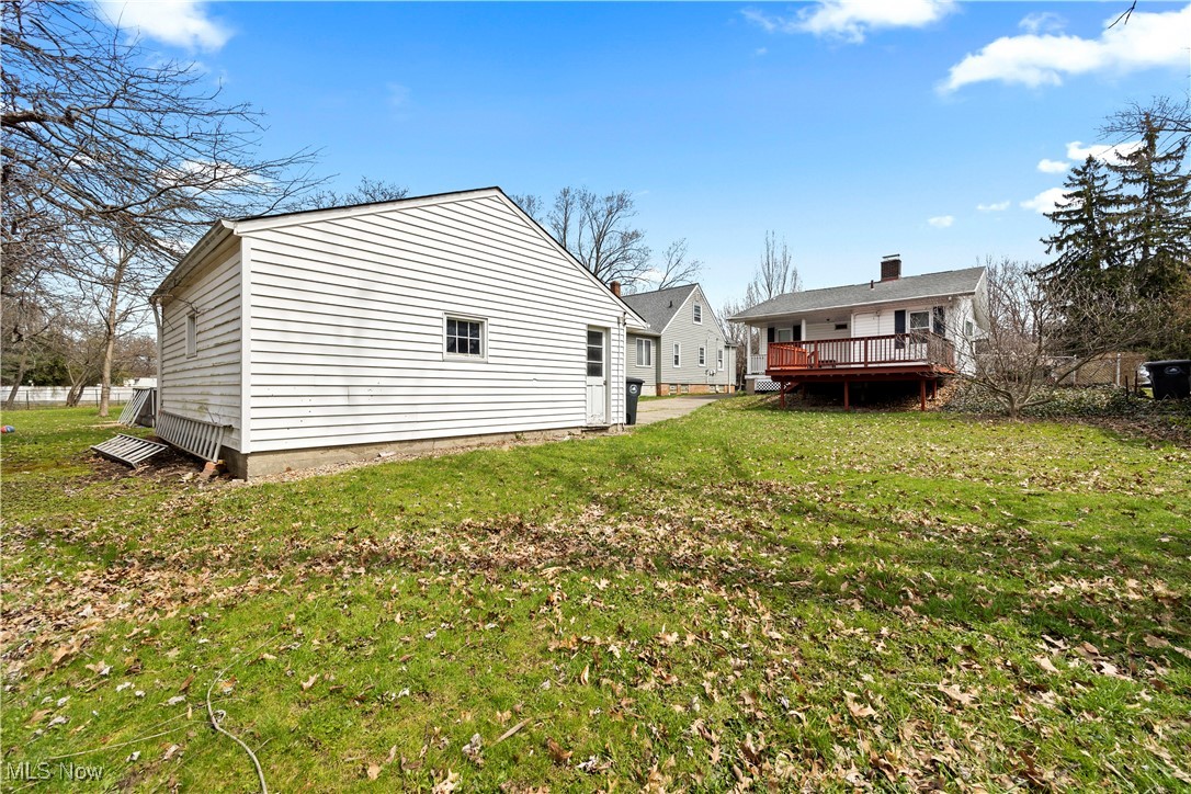1624 Edgefield Road Lyndhurst, OH 44124 - Photo 24 of 26 Rear view of house with a yard, fence, and a deck