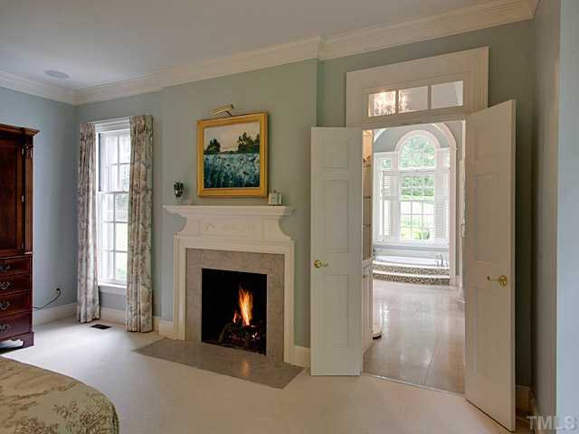 1908 Chase Court Raleigh, NC 27607 - Photo 15 of 25 a living room with furniture and a fireplace