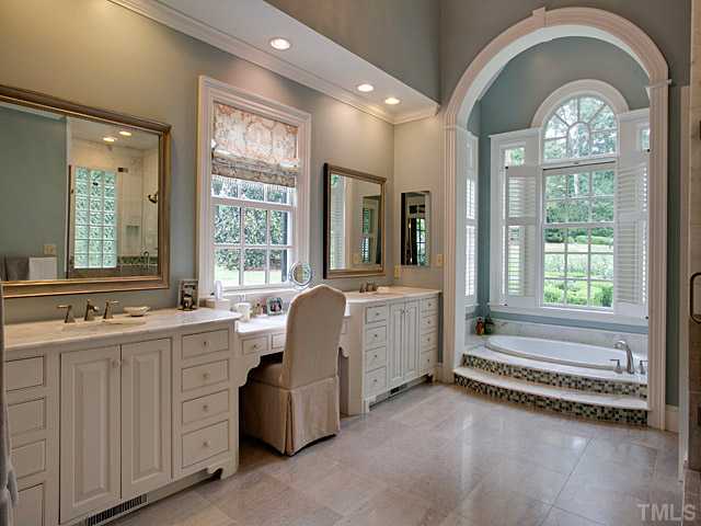 1908 Chase Court Raleigh, NC 27607 - Photo 16 of 25 a spacious bathroom with a tub a sink and mirror