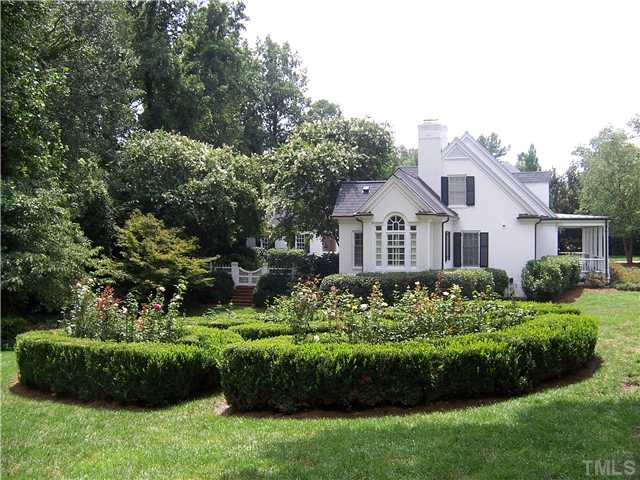 1908 Chase Court Raleigh, NC 27607 - Photo 2 of 25 a front view of a house with a garden