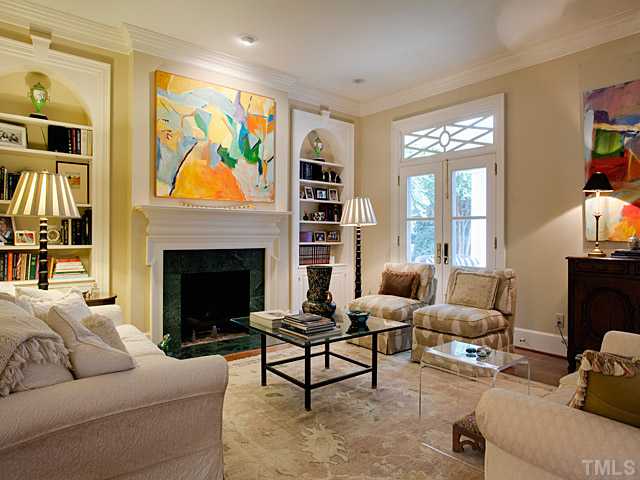 1908 Chase Court Raleigh, NC 27607 - Photo 4 of 25 a living room with furniture fireplace and window