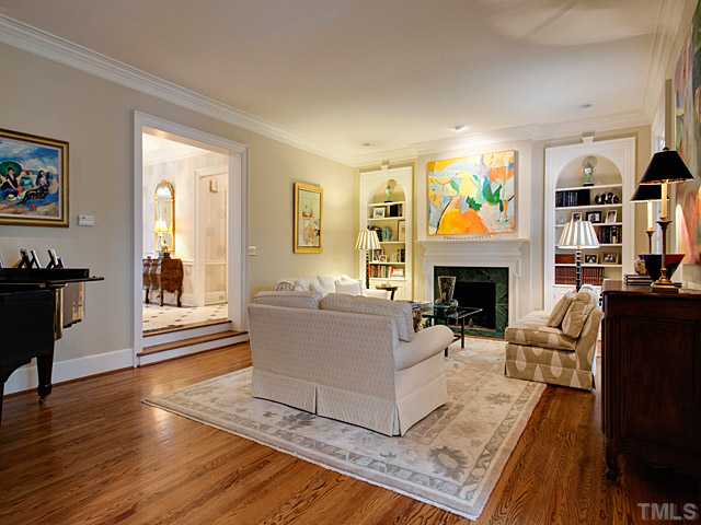 1908 Chase Court Raleigh, NC 27607 - Photo 5 of 25 a living room with furniture and a fireplace