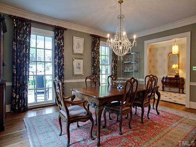 1908 Chase Court Raleigh, NC 27607 - Photo 7 of 25 a view of a dining room with furniture wooden floor and chandelier