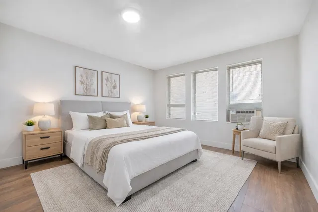 a bedroom with a bed and a couch