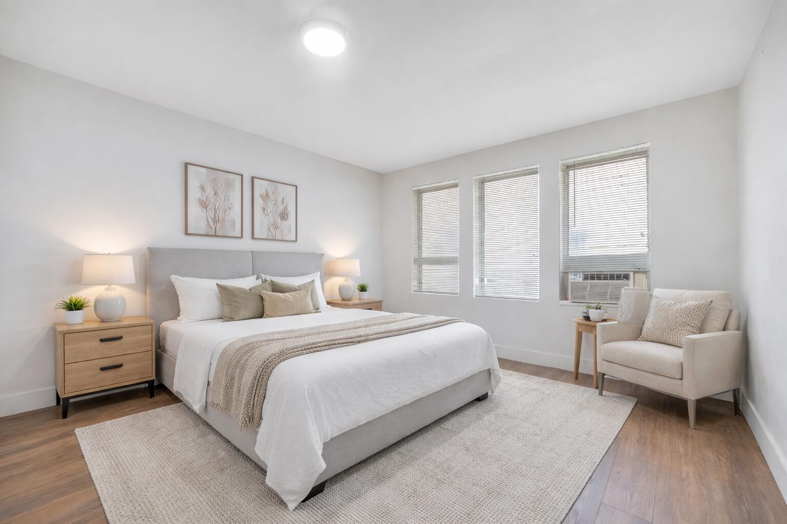 a bedroom with a bed and a couch