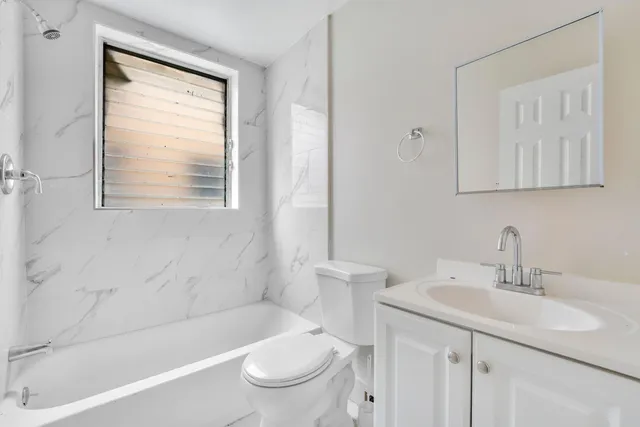 a bathroom with a sink toilet and bathtub