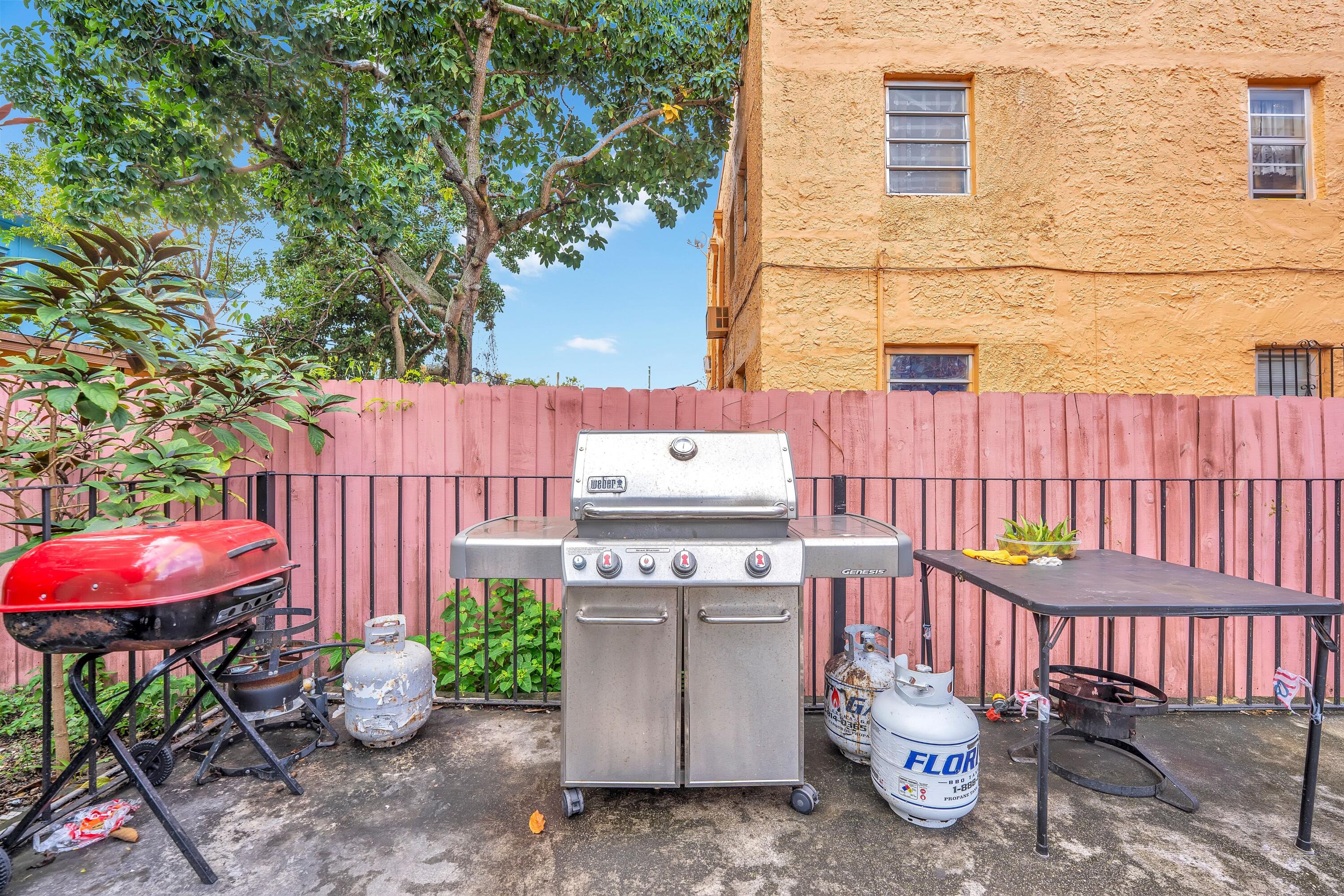 1554 Southwest 5th Street, Unit 3A Miami, FL 33135 - Photo 8 of 13 a view of a chairs and table in backyard