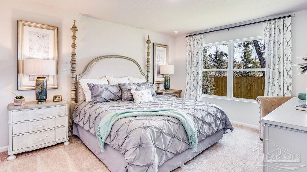 5084 Rainwater Road Milton, FL 32583 - Photo 14 of 26 a bedroom with a bed and a large window