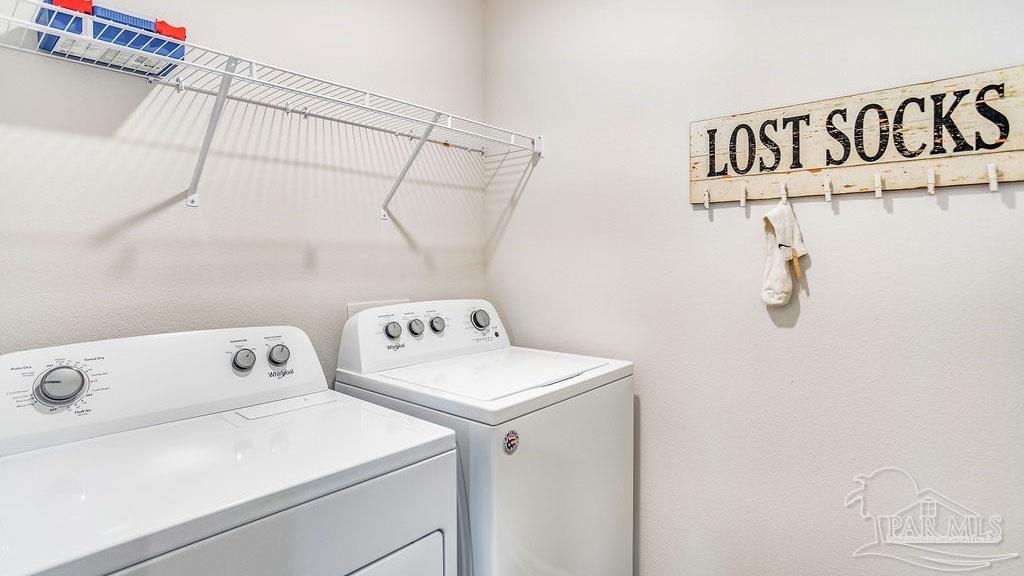 5084 Rainwater Road Milton, FL 32583 - Photo 26 of 26 a utility room with dryer and washer