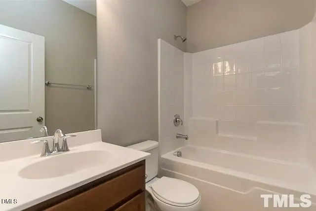 a bathroom with a sink a toilet and a bathtub