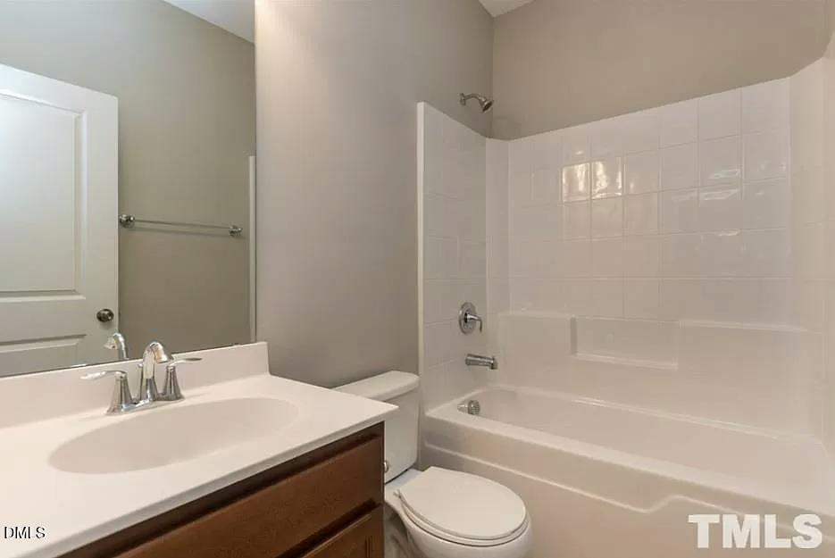 1142 Lookout Ridge Road Apex, NC 27502 - Photo 11 of 21 a bathroom with a sink a toilet and a bathtub