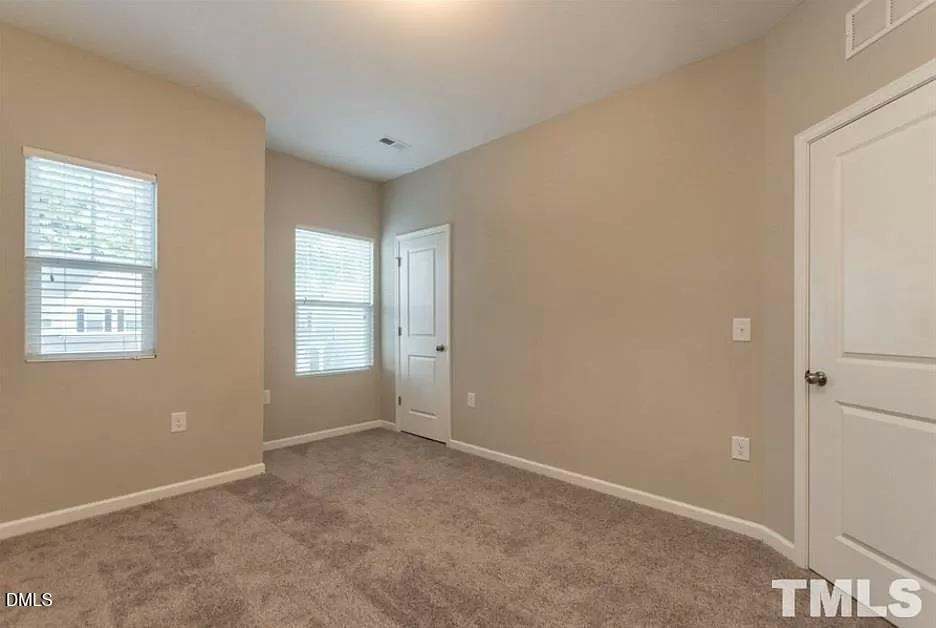 1142 Lookout Ridge Road Apex, NC 27502 - Photo 14 of 21 a view of an empty room with a window