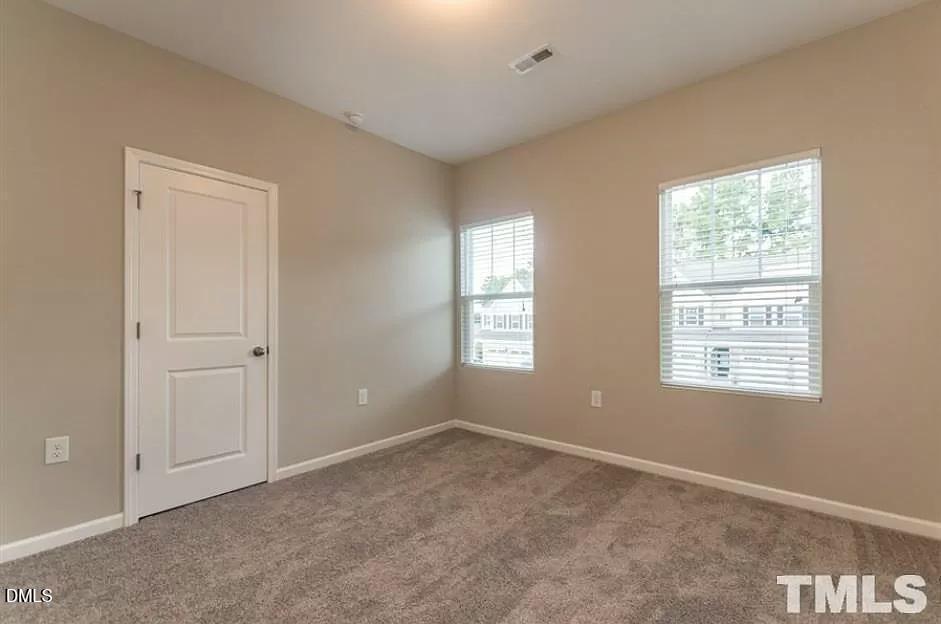 1142 Lookout Ridge Road Apex, NC 27502 - Photo 20 of 21 a view of an empty room with a window
