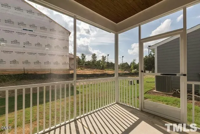 a view of a balcony with wooden floor