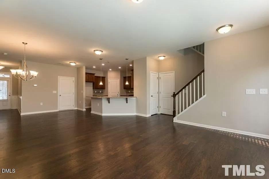1142 Lookout Ridge Road Apex, NC 27502 - Photo 8 of 21 a view of a hallway with wooden floor