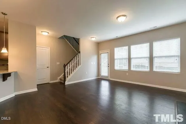 a view of an entryway with wooden floor
